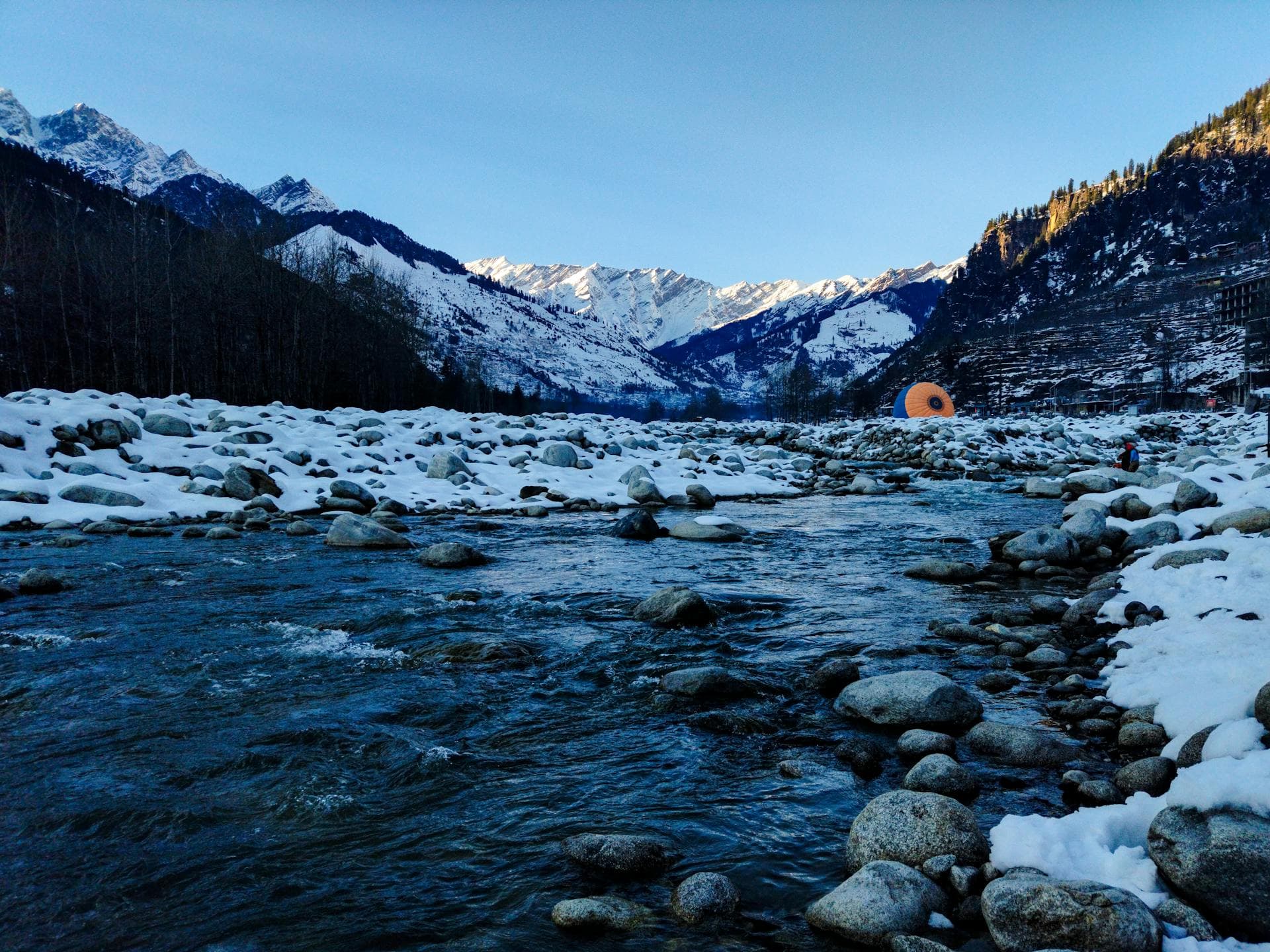 Snow-covered Himalayan peaks and a river near Manali